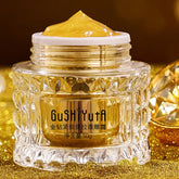 Cosmetic jar with gold cream on a glittery gold background