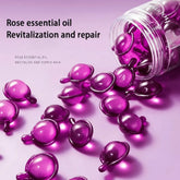 Purple essential oil capsules with a bottle on a pink background, labeled 'Rose essential oil Revitalization and repair'.