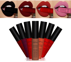 QIBEST lip cream with color swatches on lips and lip cream tubes.