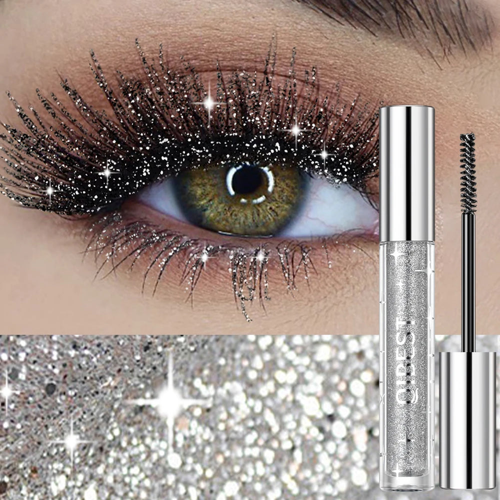 Eyelash with glitter and a mascara tube labeled 'Ciate' on a glittery background