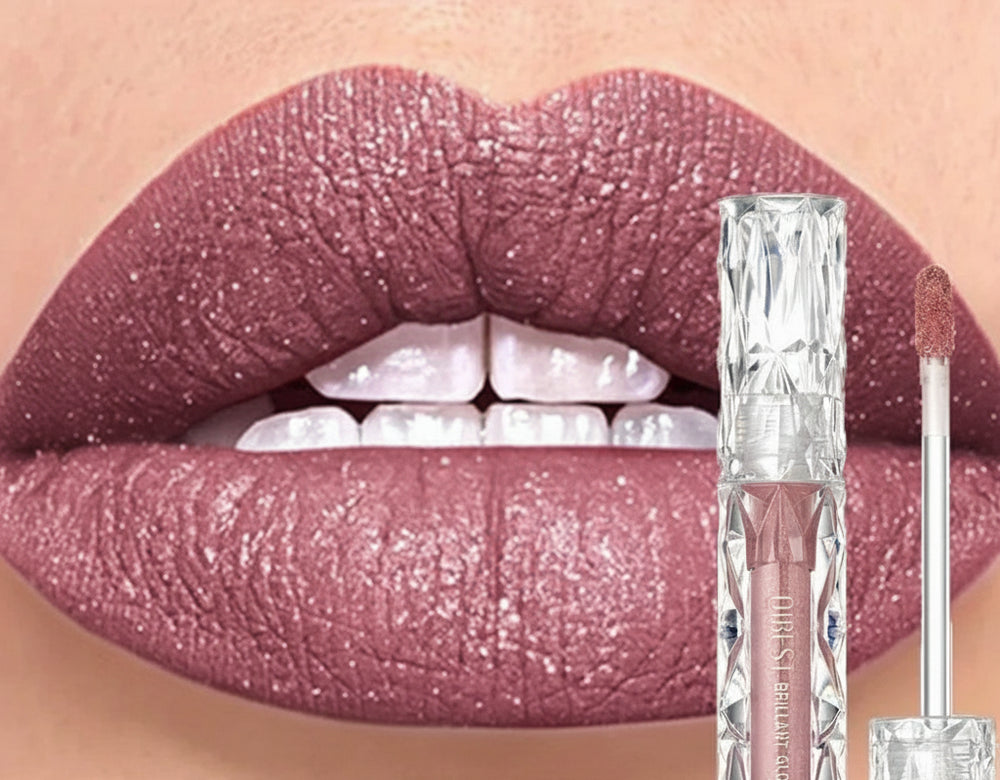 Lip gloss with glittery pink shade applied to lips, next to product packaging.