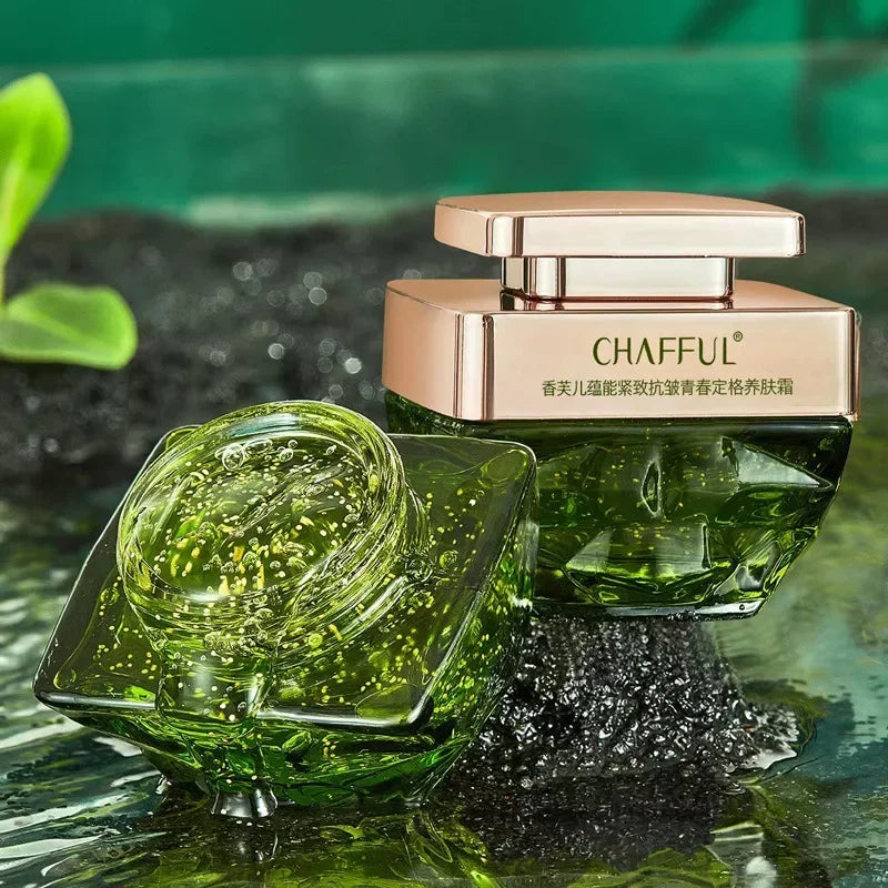 Green skincare product with rose gold cap on a green background