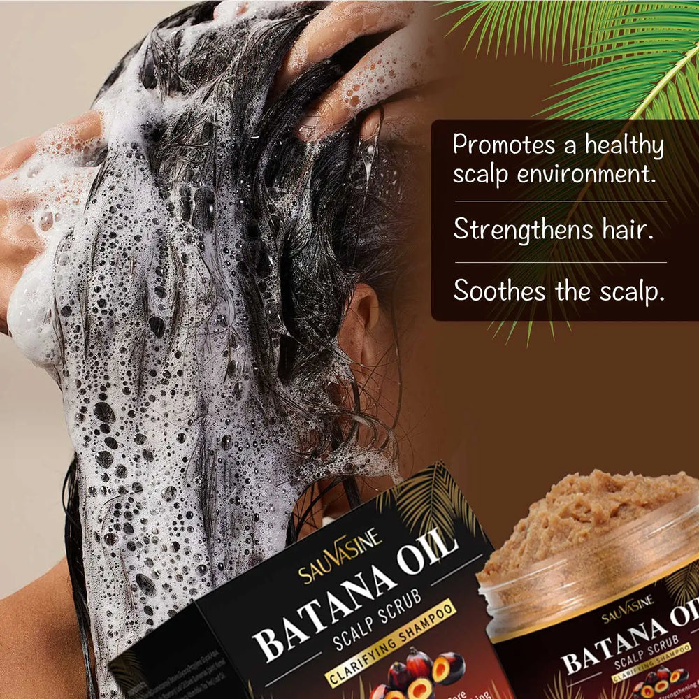 Person washing hair with a box of Sauásine Batana Oil Scalp Scrub in the foreground.
