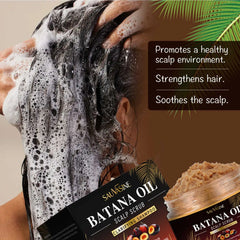 Person washing hair with a box of Sauásine Batana Oil Scalp Scrub in the foreground.