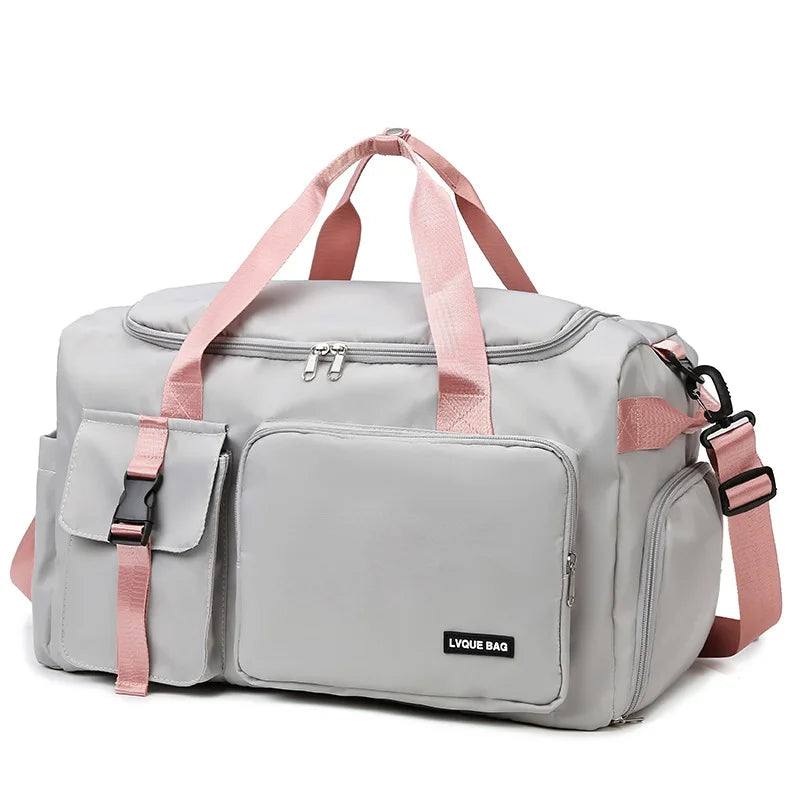 Gray duffel bag with pink straps on a white background