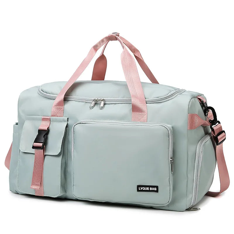 Light blue duffel bag with pink straps on a white background