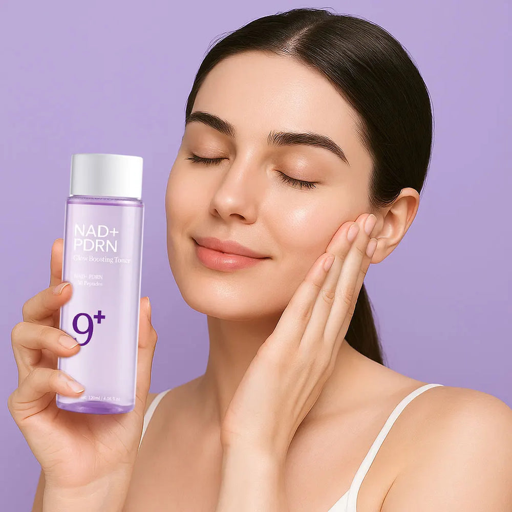 Woman holding a skincare product with a purple background