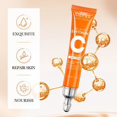 Orange eye cream tube with packaging on a beige background