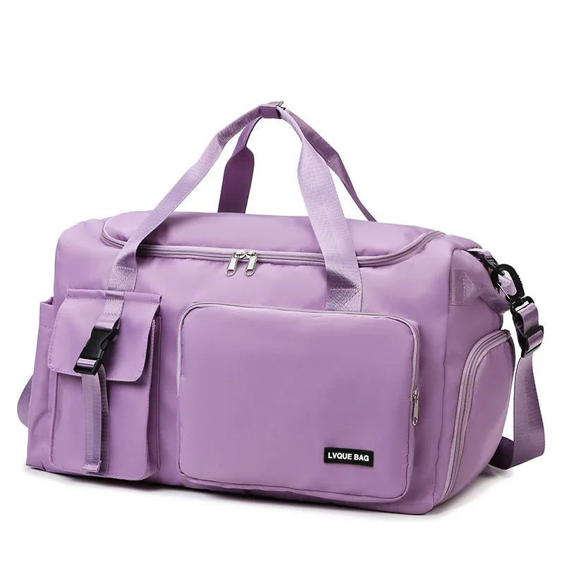 Purple duffel bag with a visible brand label on a white background