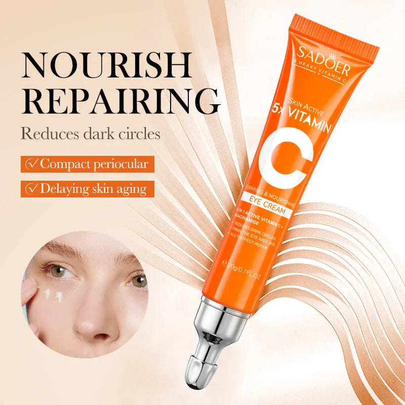 Orange eye cream tube with text on a beige background